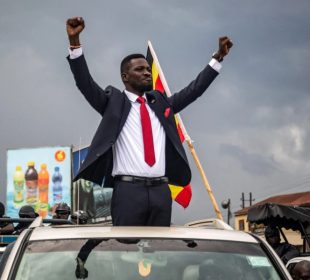 Bobi Wine with his hands up