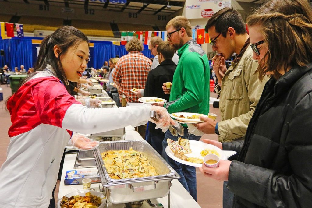 A lady serving food in a food festivals
