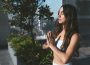 A lady outdoor meditating and journaling