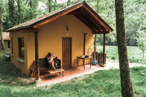 A lady sitting outside a guest house