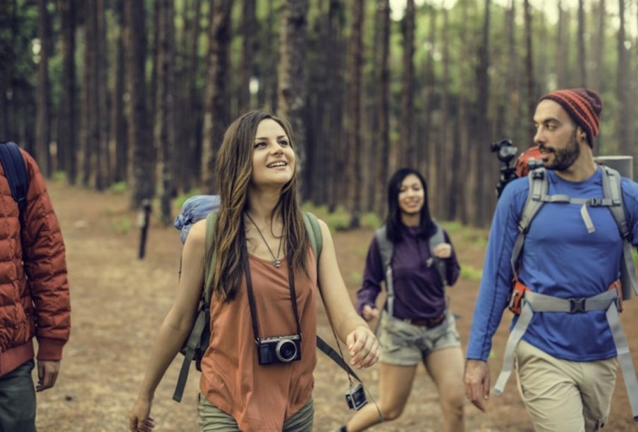 Friends Hanging out at Destination Camp with travel gadgets