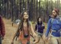 Friends Hanging out at Destination Camp with travel gadgets