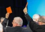 Men raising cards up in support of same sex marriage