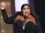 Lizzo giving a speech on stage