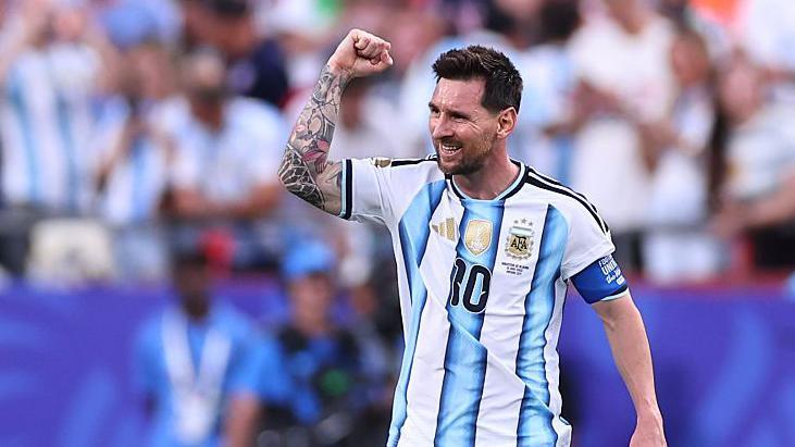 Messi Hat-Trick Breaks Ronaldo’s World Cup Record as Argentina Thrash Algeria Lionel Messi celebrating after scoring a hat-trick for Argentina against Algeria in a World Cup match, breaking Ronaldo’s record.