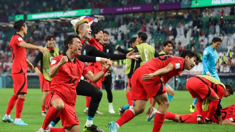 South Korea players celebrating after a 2-1 victory over Czech Republic in a World Cup opening match.